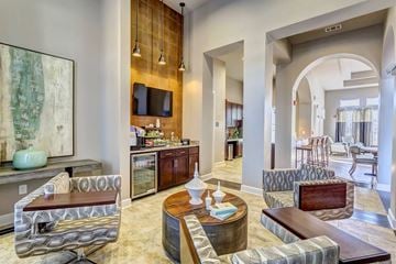 Mt Juliet apartment for rent - A living room with a large painting on the wall and a TV.