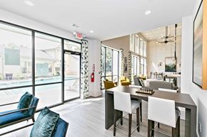 Atlanta apartment for rent - A modern kitchen with a dining table and chairs.