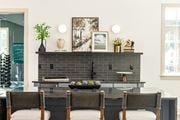 Stone Mountain townhouse for rent - a dining room with a table and chairs in front of a black brick fireplace