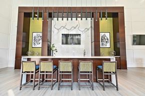 Atlanta apartment for rent - A modern clubroom with a long table and chairs.