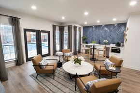 Decatur apartment for rent - a living room with a table and chairs and a pool