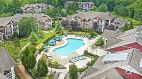 Fort Mill apartment for rent - an aerial view of a swimming pool in a community with houses at Sycamore Fort Mill, Fort Mill, SC, 29715