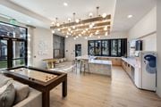 Duluth townhouse for rent - A modern kitchen with a pool table in the middle.