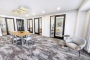 Duluth townhouse for rent - A modern dining room with a wooden table and grey chairs.