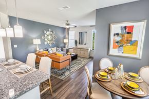 Mt Juliet apartment for rent - A modern dining room with a round table set for six.