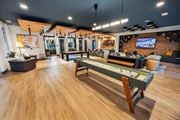 Dacula townhouse for rent - A room with a pool table and a bar.