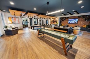 Dacula townhouse for rent - A room with a pool table and a bar.