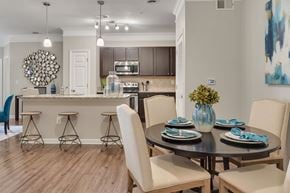 Mooresville apartment for rent - A modern dining room with a round table set for four at Echo at Lake Norman, Mooresville