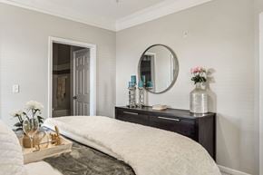 Mooresville apartment for rent - A bedroom with a large bed and a mirror above it at Echo at Lake Norman, Mooresville