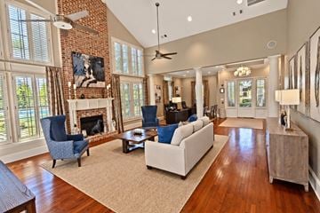 Grayson apartment for rent - A living room with a fireplace and a blue chair.