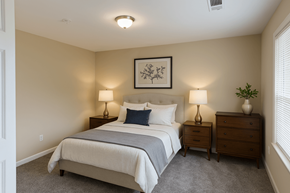 Lilburn apartment for rent - A bedroom with a bed, nightstands, and a framed picture on the wall.
