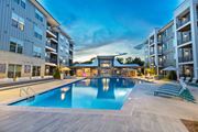 Charlotte apartment for rent - an apartment building with a swimming pool in front of it
