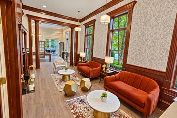 Alpharetta townhouse for rent - A living room with a red couch and a white coffee table.
