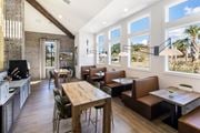 North Charleston apartment for rent - a dining room with tables and chairs and large windows