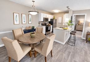 Dunwoody apartment for rent - A kitchen with a dining table and chairs.