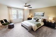 Stone Mountain townhouse for rent - a bedroom with a bed and a ceiling fan