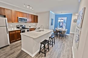 Suwanee apartment for rent - model kitchen and island at The Pointe at Suwanee Station, Suwanee, GA