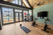 Lawrenceville apartment for rent - a home gym with a pool and sliding glass doors