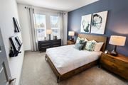 Lawrenceville apartment for rent - a bedroom with a bed and two windows