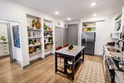 Lawrenceville apartment for rent - a kitchen with a center island and a stainless steel refrigerator