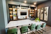 Lawrenceville apartment for rent - a dining room with a marble table and green chairs