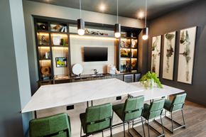 Lawrenceville apartment for rent - a dining room with a marble table and green chairs