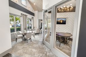 Grayson apartment for rent - A dining room with a table and chairs is shown.