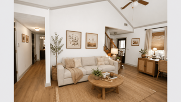 Lawrenceville triplex for rent - A living room with a white couch and a wooden coffee table.