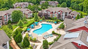 Fort Mill apartment for rent - An aerial view of a resort with a swimming pool and multiple buildings.