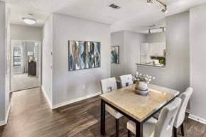 Brentwood apartment for rent - A dining room with a wooden table and chairs.