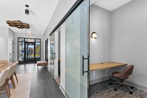 Rocky Hill apartment for rent - A conference room with a glass wall and a wooden table.