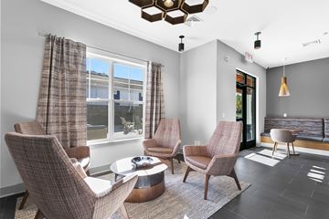 Rocky Hill apartment for rent - A living room with a brown chair and a brown table.