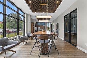West Hartford apartment for rent - A modern dining room with a wooden table and chairs.