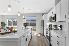 Rocky Hill apartment for rent - A modern kitchen with white cabinets and a large island.