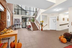 Williamstown apartment for rent - the living room with pumpkins on the floor and a staircase