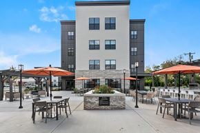Newington apartment for rent - A modern building with a courtyard in front.