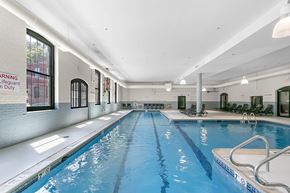 Manchester apartment for rent - a swimming pool in a building with a blue water floor and at Clocktower and Velvet Mill Apartments, Connecticut