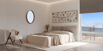 New London apartment for rent - A bedroom with a large bed and a view of the beach.