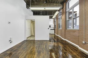 Hartford apartment for rent - A room with wooden floors and a white wall.