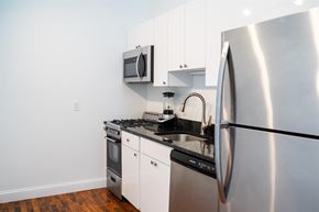 Hartford apartment for rent - A modern kitchen with a stainless steel refrigerator, microwave, and oven.