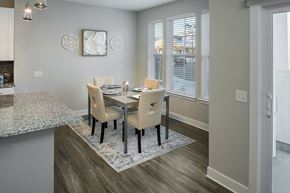 Scarborough apartment for rent - a dining room with a table and chairs and a window at The Beacon at Gateway Apartments, Scarborough, ME, 04074