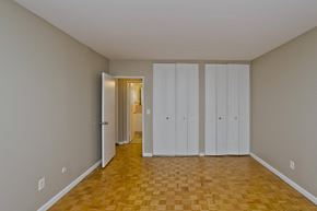 Springfield apartment for rent - a living room with a wood floor and white closets on the wall at Park Edge, Springfield, MA, 13502