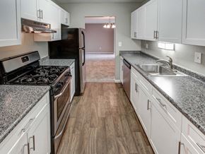 Rocky Hill apartment for rent - a kitchen with white cabinets and stainless steel appliances at Stepny Place, Rocky Hill, 06067
