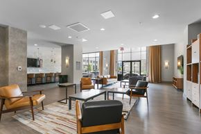 Bridgeport apartment for rent - a lounge area with chairs and tables in a lobby at 1188 Lofts, Bridgeport, 06604