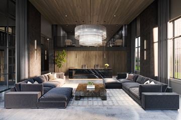 New Haven apartment for rent - A modern living room with a large grey sofa set and a wooden ceiling.