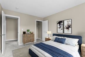 Norwich apartment for rent - A bedroom with a large bed and a wooden dresser at Rose Hill Estates, Norwich, CT, 06360
