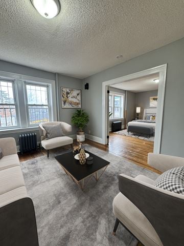 Hartford apartment for rent - A living room with a black coffee table and a grey sofa.