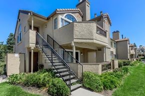 Pittsburg apartment for rent - A beige house with a black metal staircase.