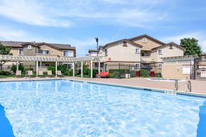 Pittsburg apartment for rent - A large swimming pool in front of apartment buildings.