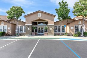 Pittsburg apartment for rent - A building with a parking lot in front of it.